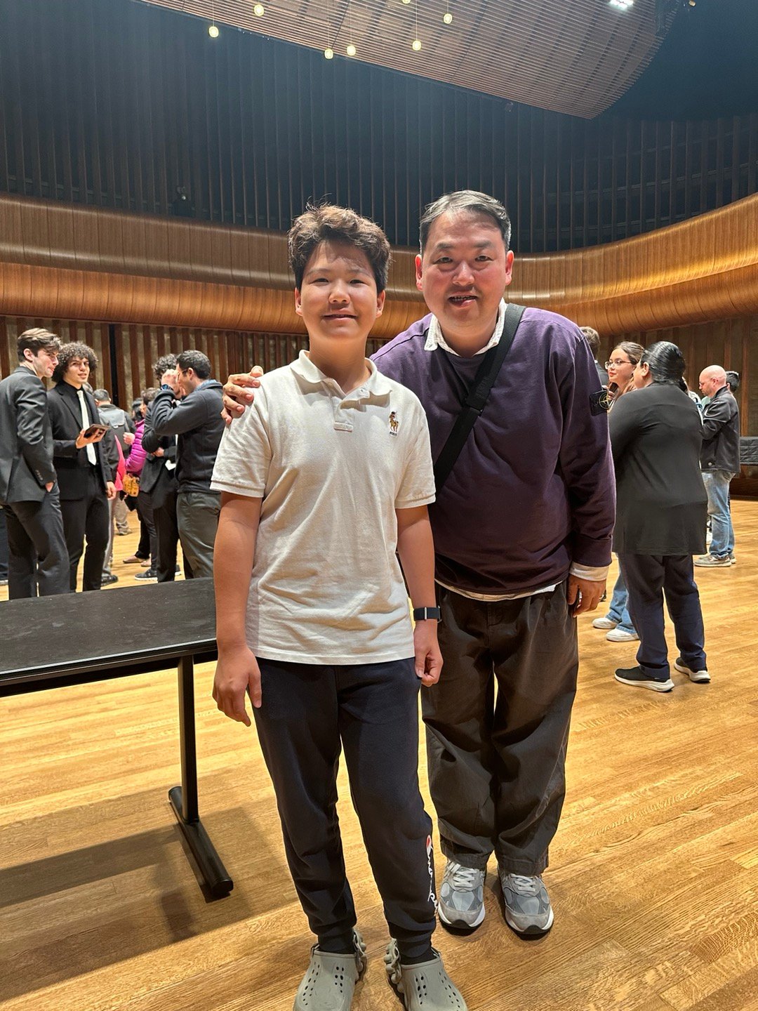 Student with Prof. Kim in concert hall after NTC 2024