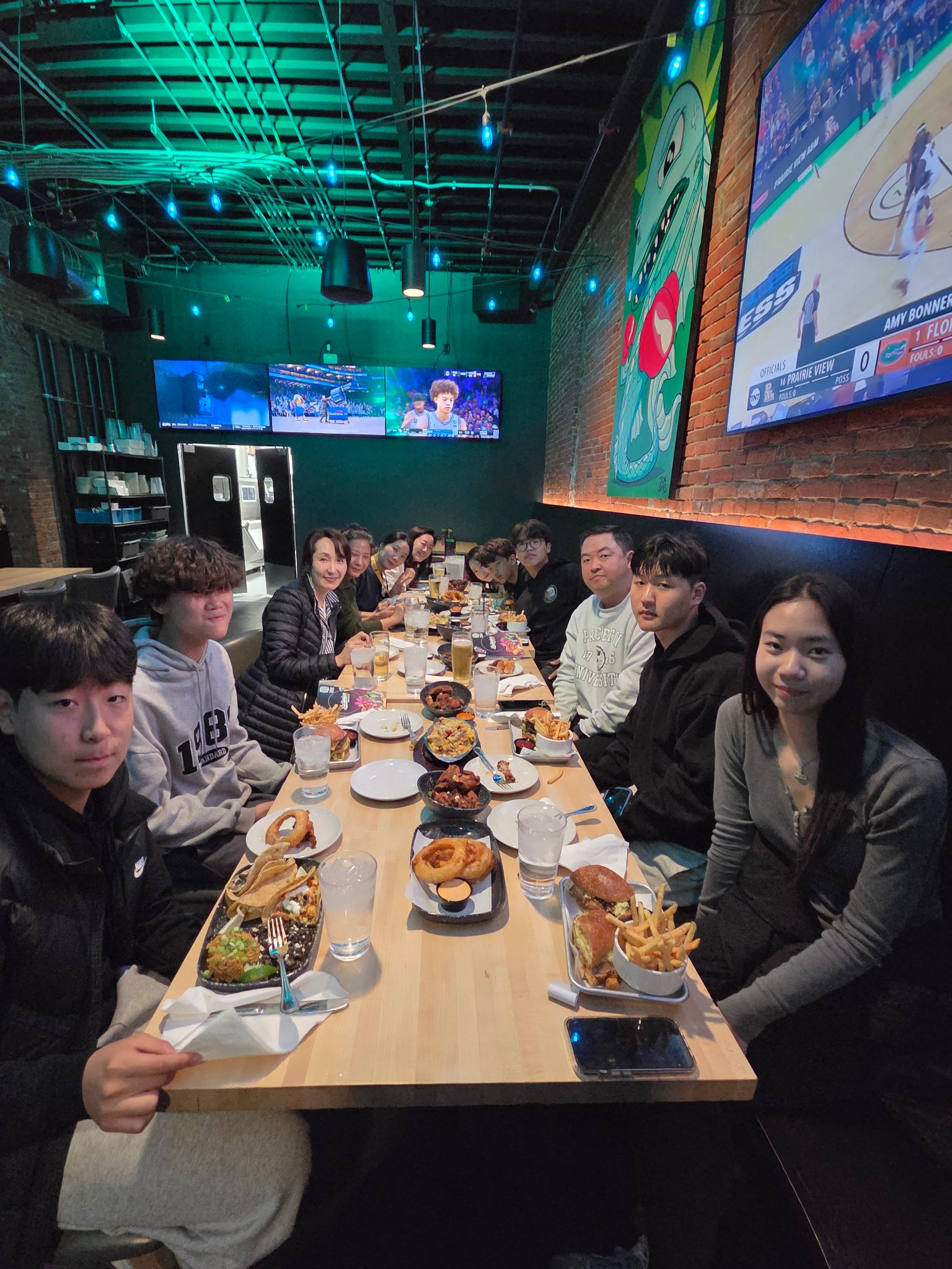 Students and faculty at dinner celebration