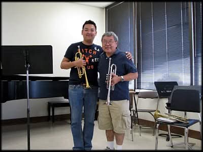 Matthew Kim with trumpet colleague in rehearsal room